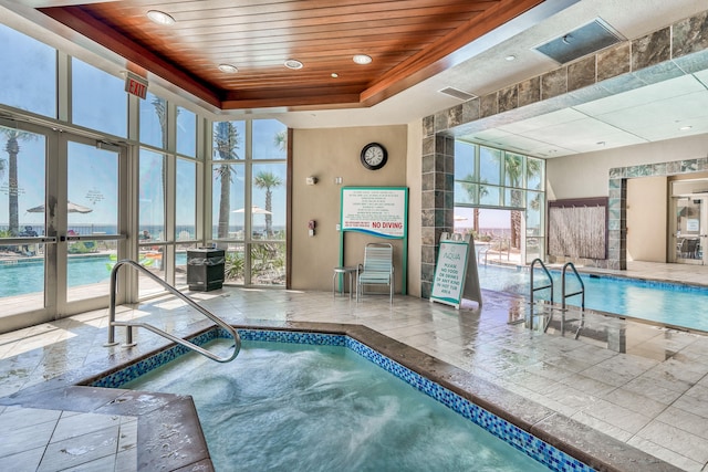 view of pool featuring french doors