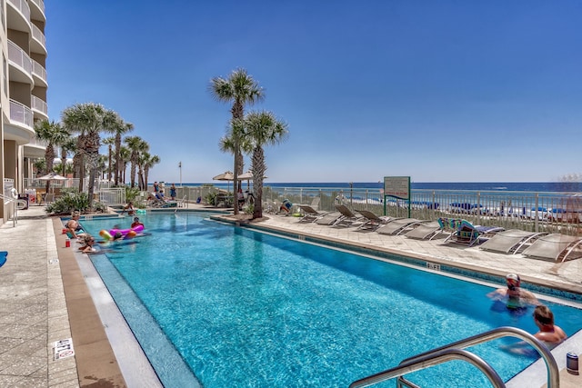 view of pool featuring a water view