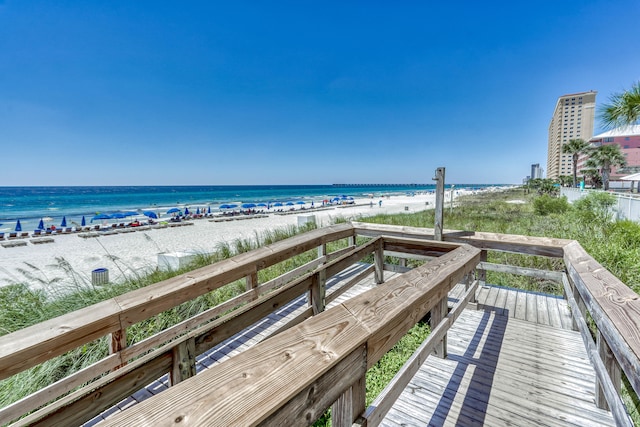 exterior space featuring a beach view and a water view