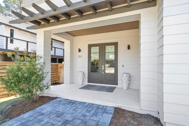 property entrance with french doors and a pergola