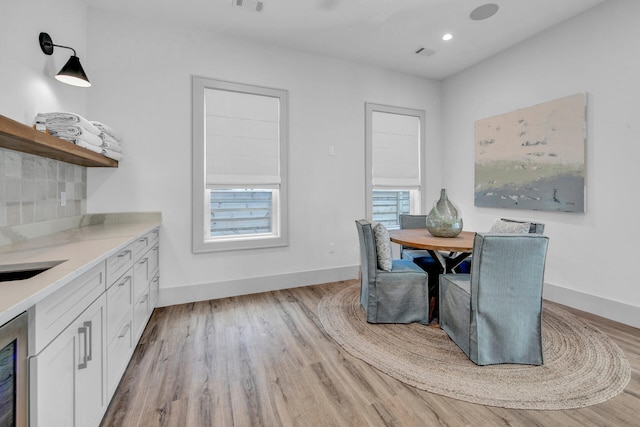 dining space with light wood-type flooring