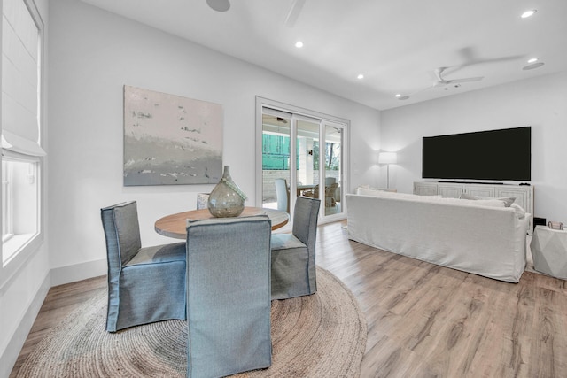 dining area featuring light hardwood / wood-style flooring and ceiling fan