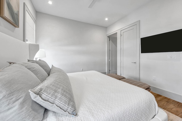 bedroom with hardwood / wood-style flooring and ceiling fan