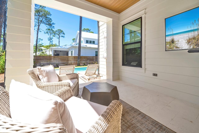 sunroom / solarium featuring wood ceiling