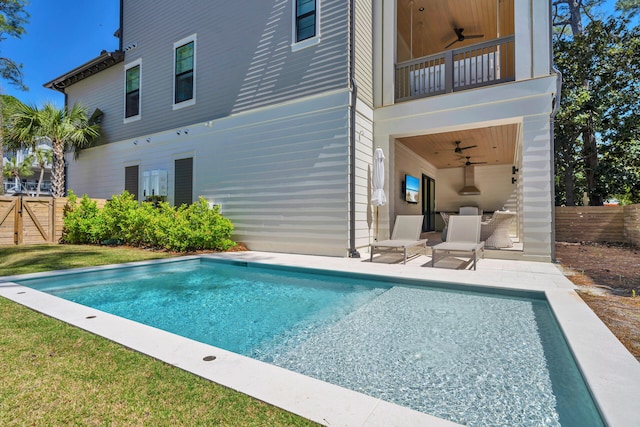 view of pool featuring a patio and ceiling fan