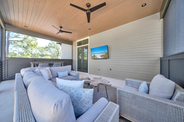 exterior space featuring wood ceiling and ceiling fan