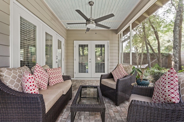 sunroom / solarium featuring french doors and ceiling fan