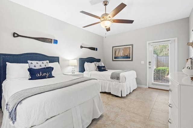 tiled bedroom with ceiling fan and access to outside