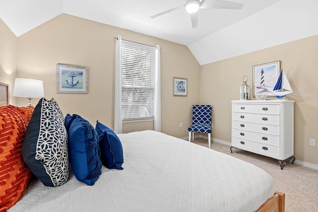 bedroom featuring light carpet, lofted ceiling, and ceiling fan