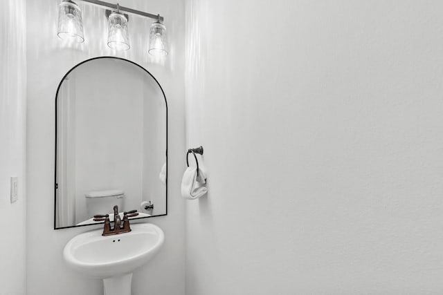 bathroom with toilet and sink