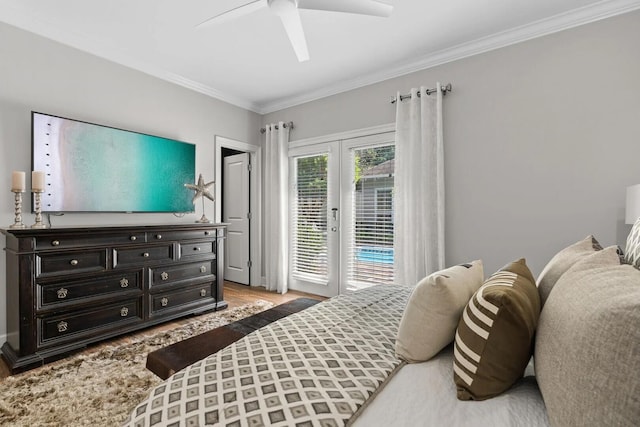 bedroom with access to outside, french doors, crown molding, light hardwood / wood-style flooring, and ceiling fan