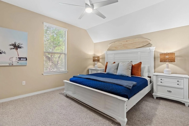 bedroom with light carpet, vaulted ceiling, and ceiling fan