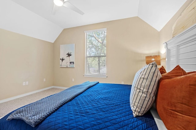 carpeted bedroom featuring ceiling fan and vaulted ceiling