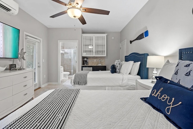 bedroom featuring light carpet, ceiling fan, ensuite bath, and an AC wall unit