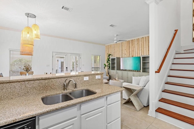 kitchen with ceiling fan, sink, white cabinetry, plenty of natural light, and pendant lighting