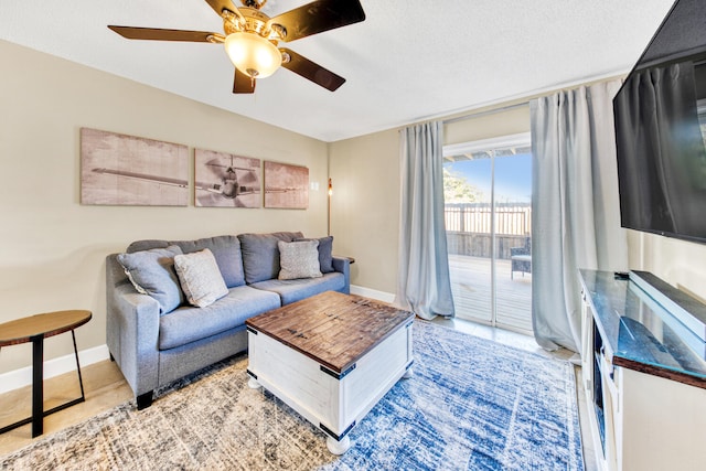 living room featuring ceiling fan