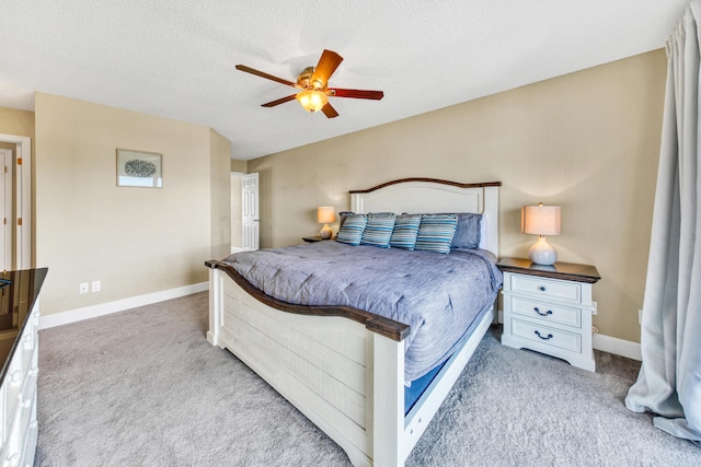 carpeted bedroom with a textured ceiling and ceiling fan