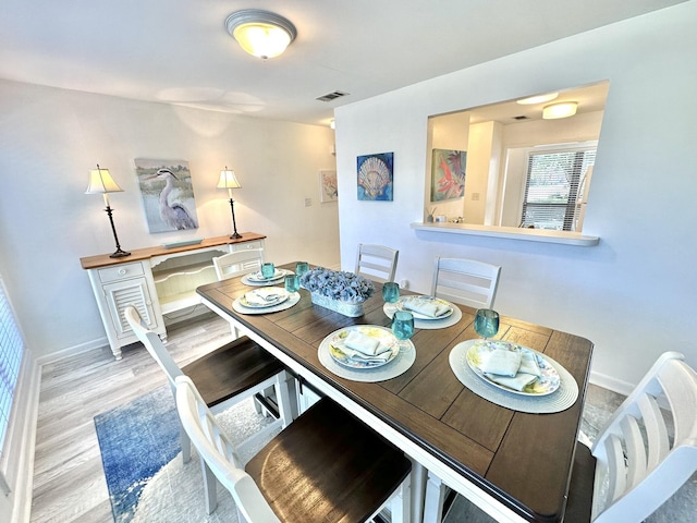 dining area featuring hardwood / wood-style flooring