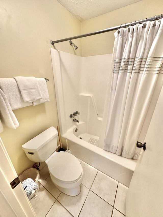 bathroom with toilet, shower / bath combo, a textured ceiling, and tile patterned floors