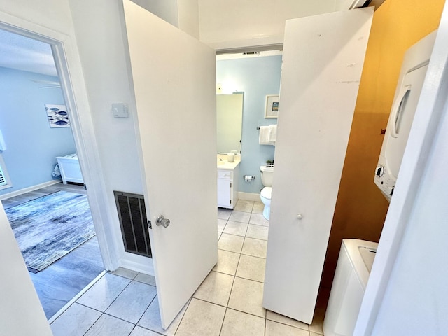 hallway with light tile patterned floors