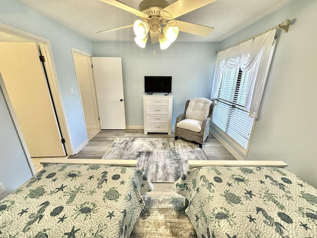 bedroom featuring ceiling fan and light wood-type flooring