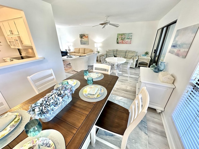 dining room featuring hardwood / wood-style flooring and ceiling fan