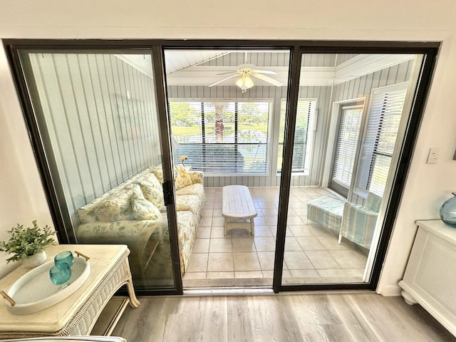 entryway with ceiling fan and light hardwood / wood-style floors