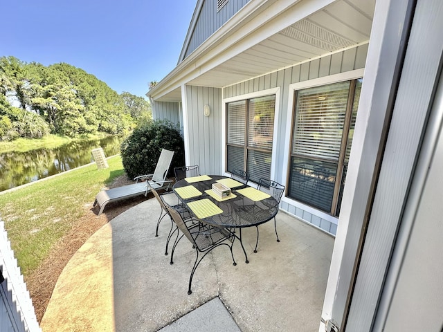 view of patio featuring a water view