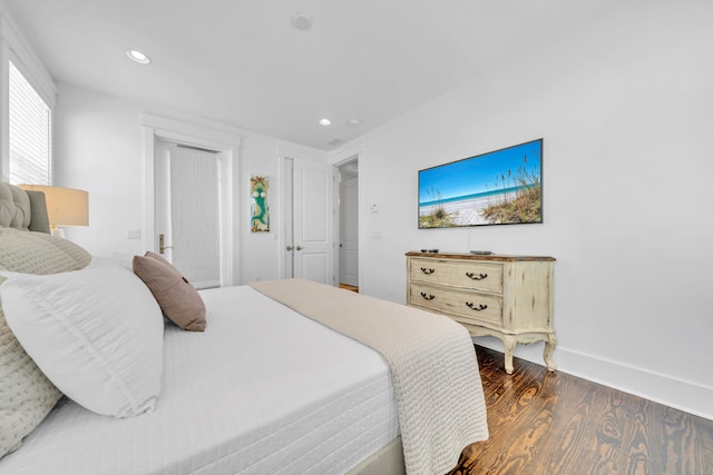 bedroom featuring dark wood-type flooring