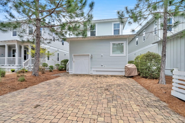 rear view of property with a porch