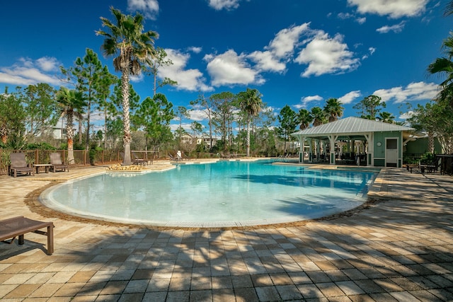 view of pool with a patio and a gazebo