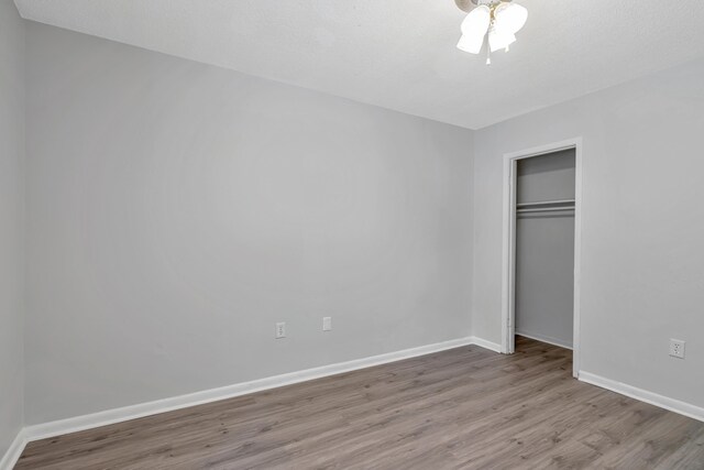 unfurnished bedroom featuring a closet and light hardwood / wood-style flooring