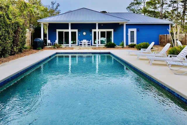 rear view of property featuring a patio area