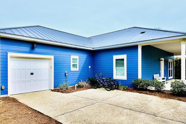 view of side of home featuring a garage