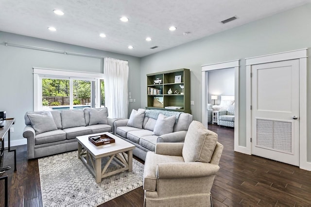 living room with dark hardwood / wood-style floors