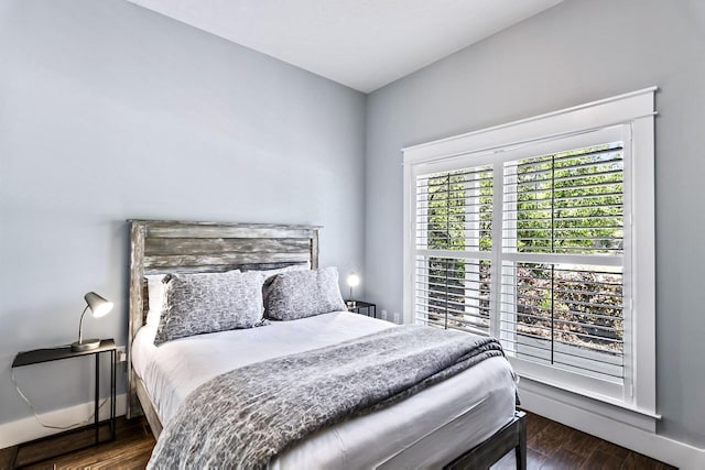 bedroom featuring dark hardwood / wood-style flooring