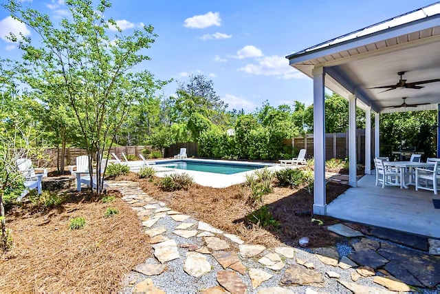 view of swimming pool with a patio area and ceiling fan