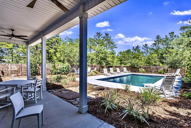 view of swimming pool featuring a patio area and ceiling fan