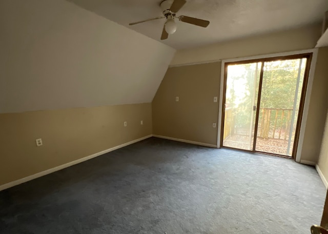 bonus room featuring lofted ceiling, dark colored carpet, and ceiling fan