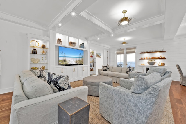 living room featuring beamed ceiling, built in shelves, light hardwood / wood-style flooring, and french doors