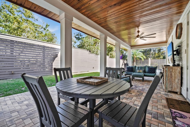 view of patio featuring an outdoor hangout area and ceiling fan