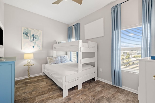 bedroom featuring ceiling fan and dark wood-type flooring