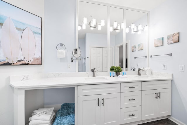 bathroom featuring hardwood / wood-style flooring and vanity