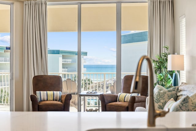 interior space featuring a water view and sink