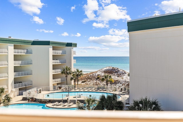 view of pool featuring a water view