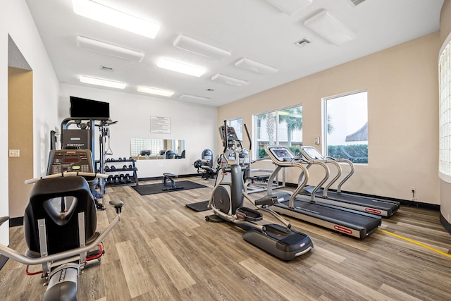 gym with hardwood / wood-style floors