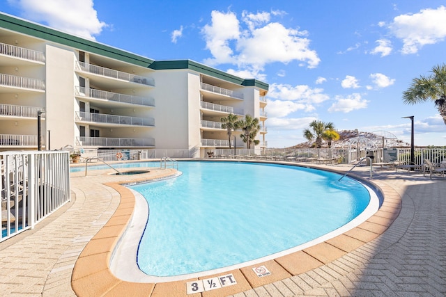 view of swimming pool featuring a patio