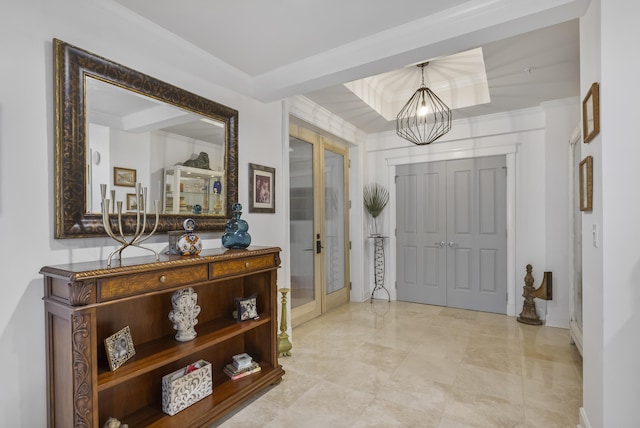 tiled entryway with french doors and beam ceiling