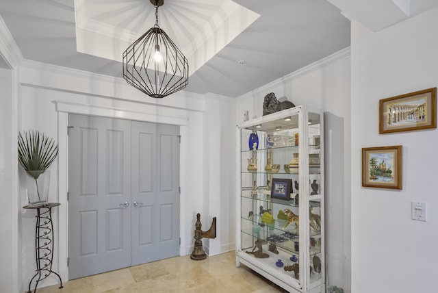 interior space with ornamental molding and light tile patterned floors