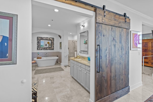 bathroom featuring vanity, tile walls, a washtub, and tile patterned floors